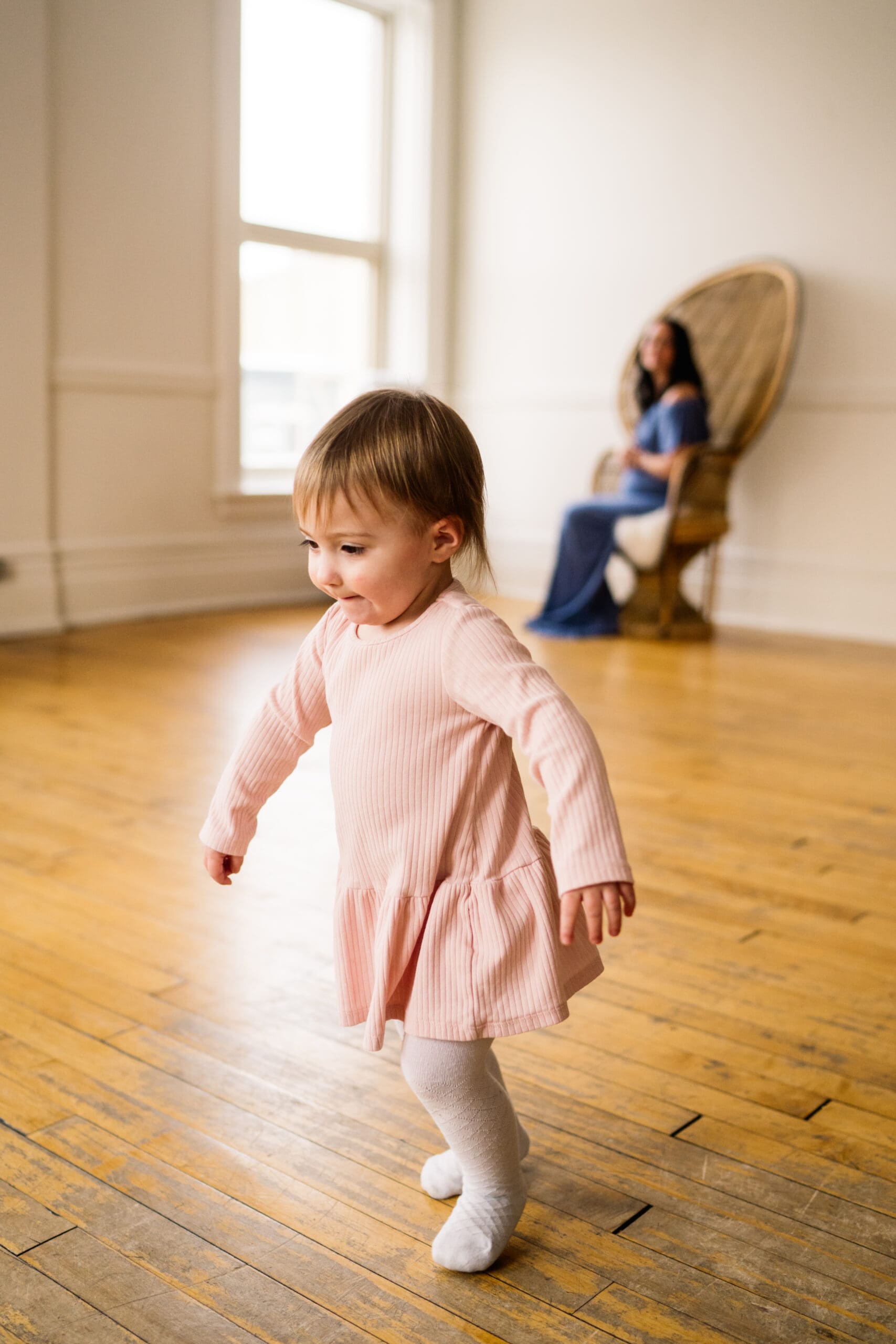 winnipeg maternity photoshoot with toddler running around in studio