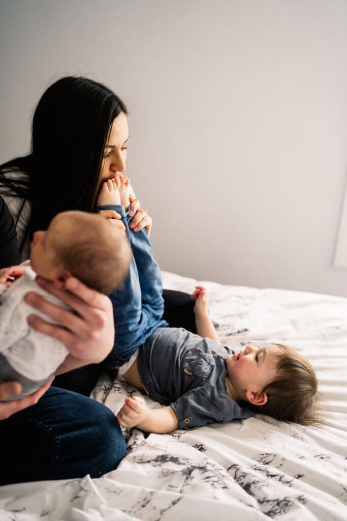 winnipeg family photographer capturing newborn baby in home during a lifestyle session