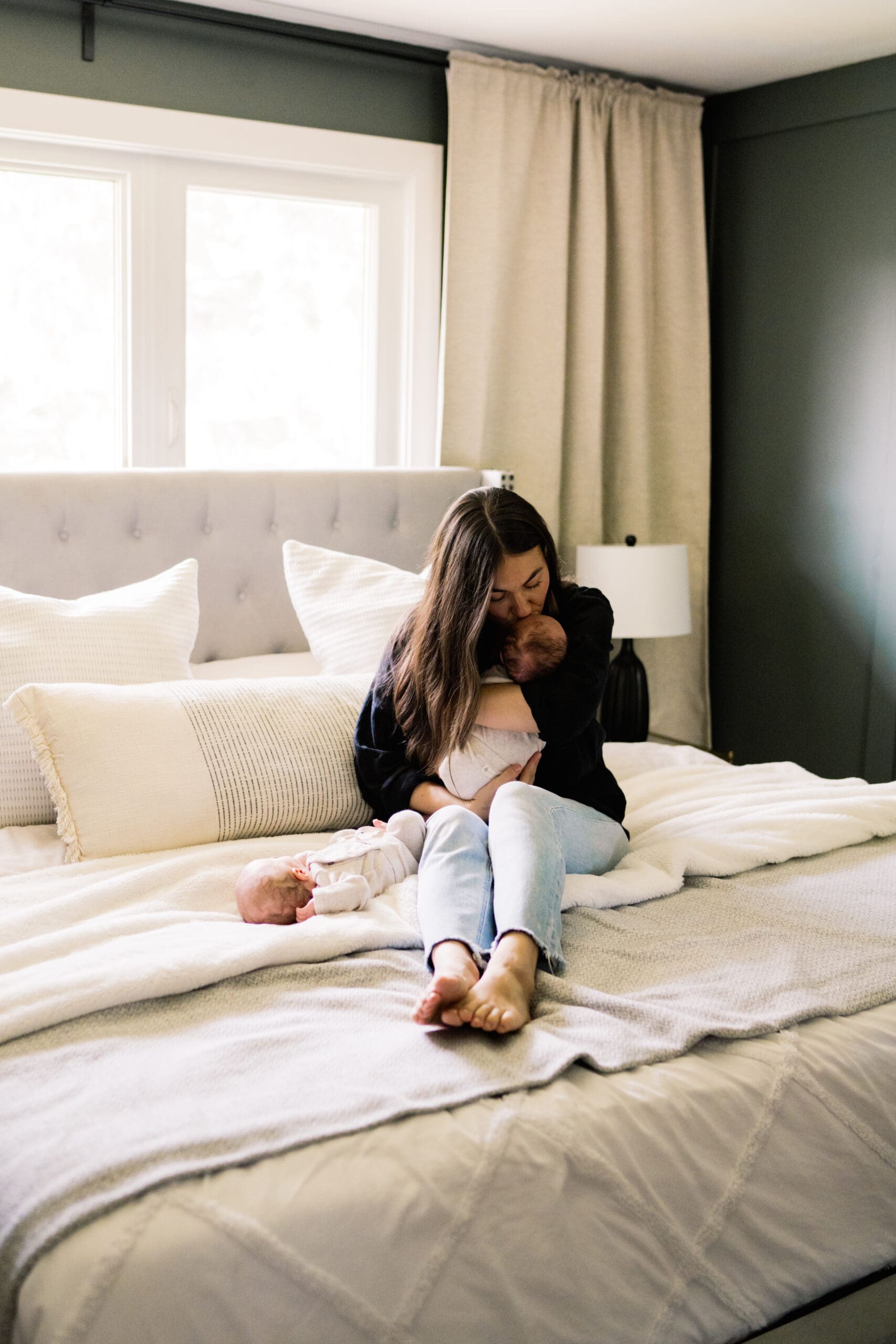 winnipeg newborn lifestyle photographer capturing twins in home