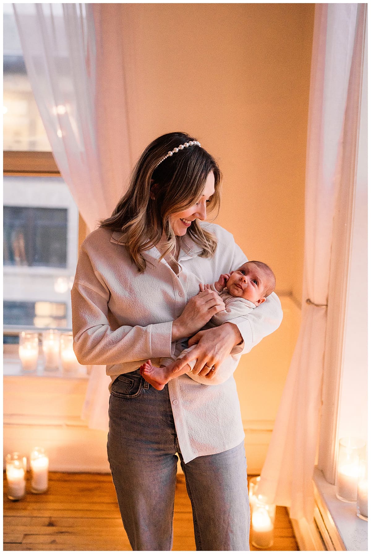 winnipeg newborn lifestyle photographer captures mom in candlelight mini session in studio