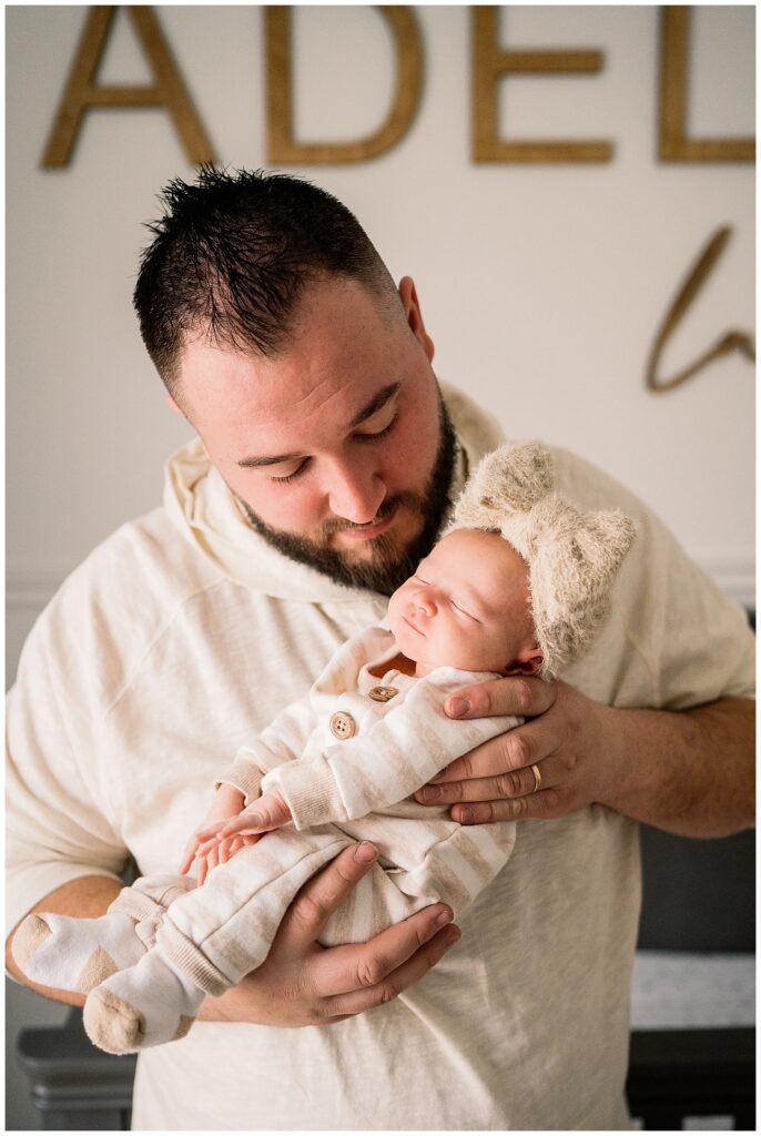 winnipeg newborn lifestyle photographer with an in home baby and parents 