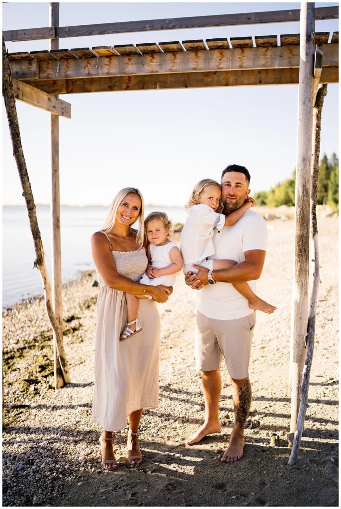 Winnipeg family photoshoot at Matlock Beach in the summer with beautiful morning light running around with their son and daughter.