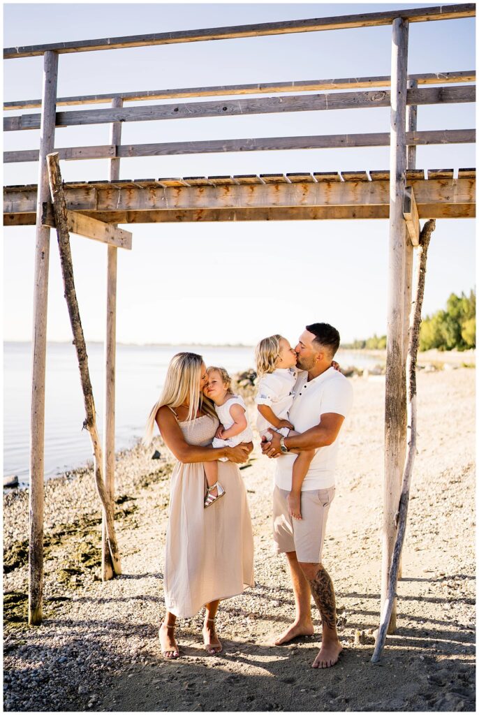 Winnipeg family photoshoot at Matlock Beach in the summer with beautiful morning light running around with their son and daughter.