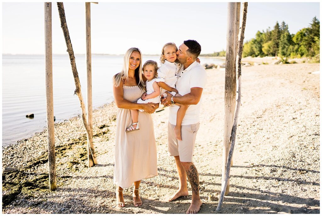 Winnipeg family photoshoot at Matlock Beach in the summer with beautiful morning light running around with their son and daughter.