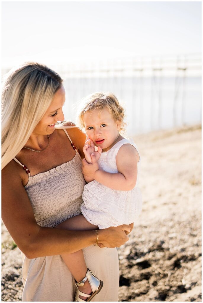 Winnipeg family photoshoot at Matlock Beach in the summer with beautiful morning light running around with their son and daughter.
