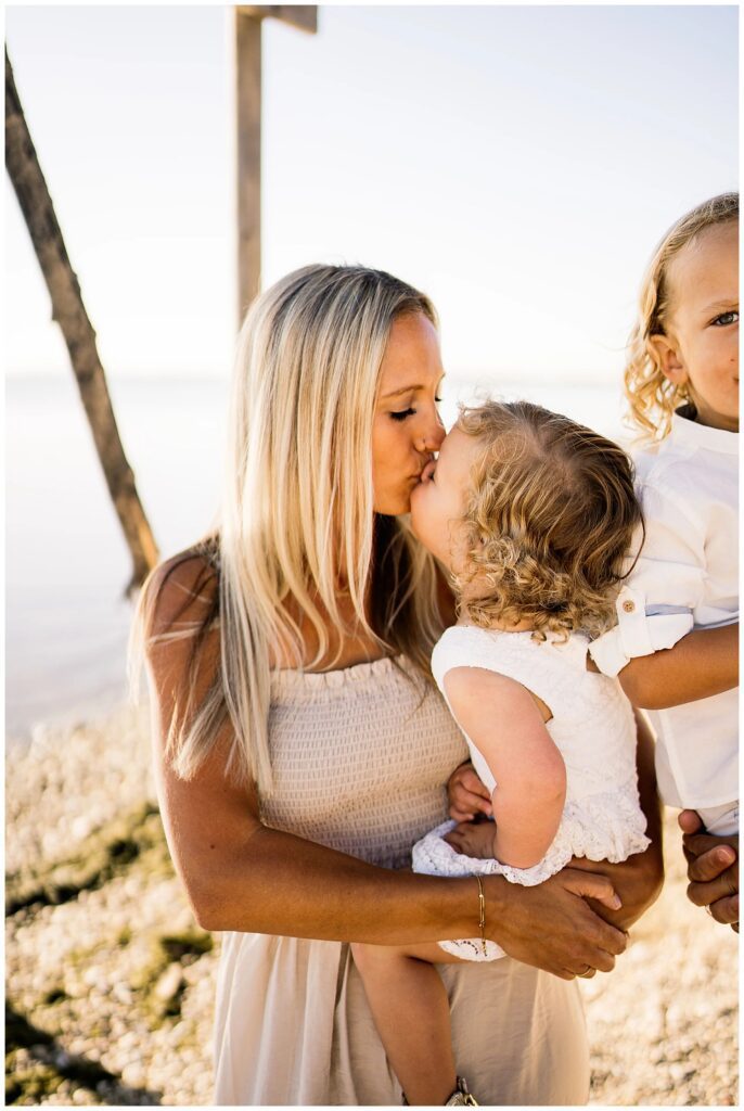 Winnipeg family photoshoot at Matlock Beach in the summer with beautiful morning light running around with their son and daughter.