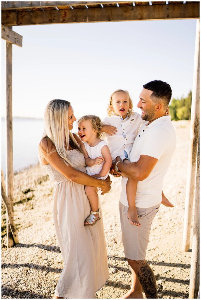 Winnipeg family photoshoot at Matlock Beach in the summer with beautiful morning light running around with their son and daughter.