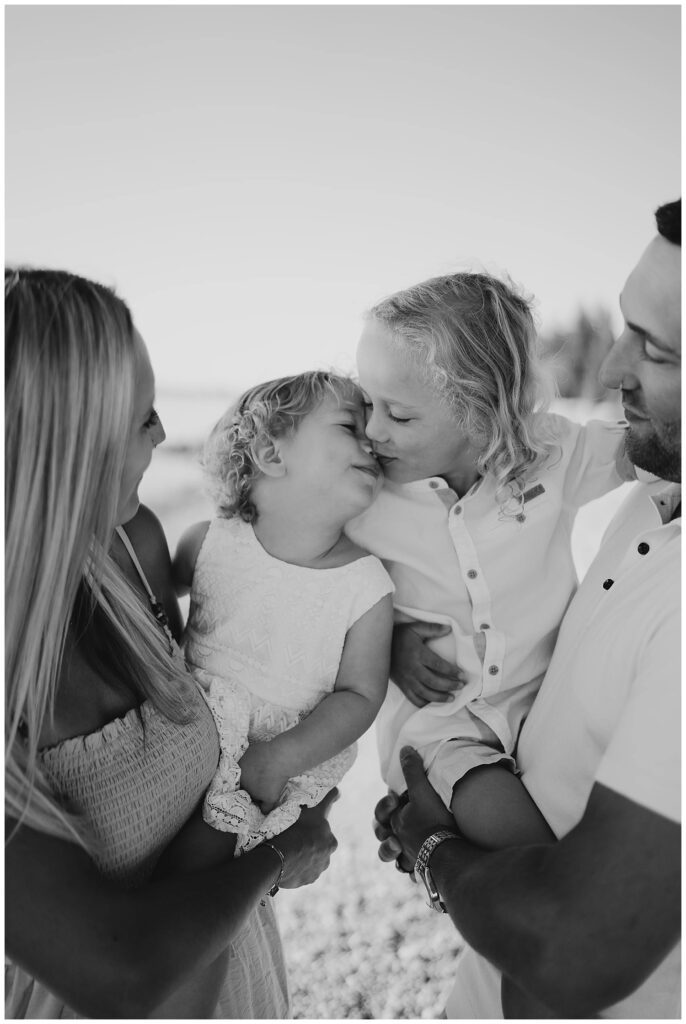 Winnipeg family photoshoot at Matlock Beach in the summer with beautiful morning light running around with their son and daughter.
