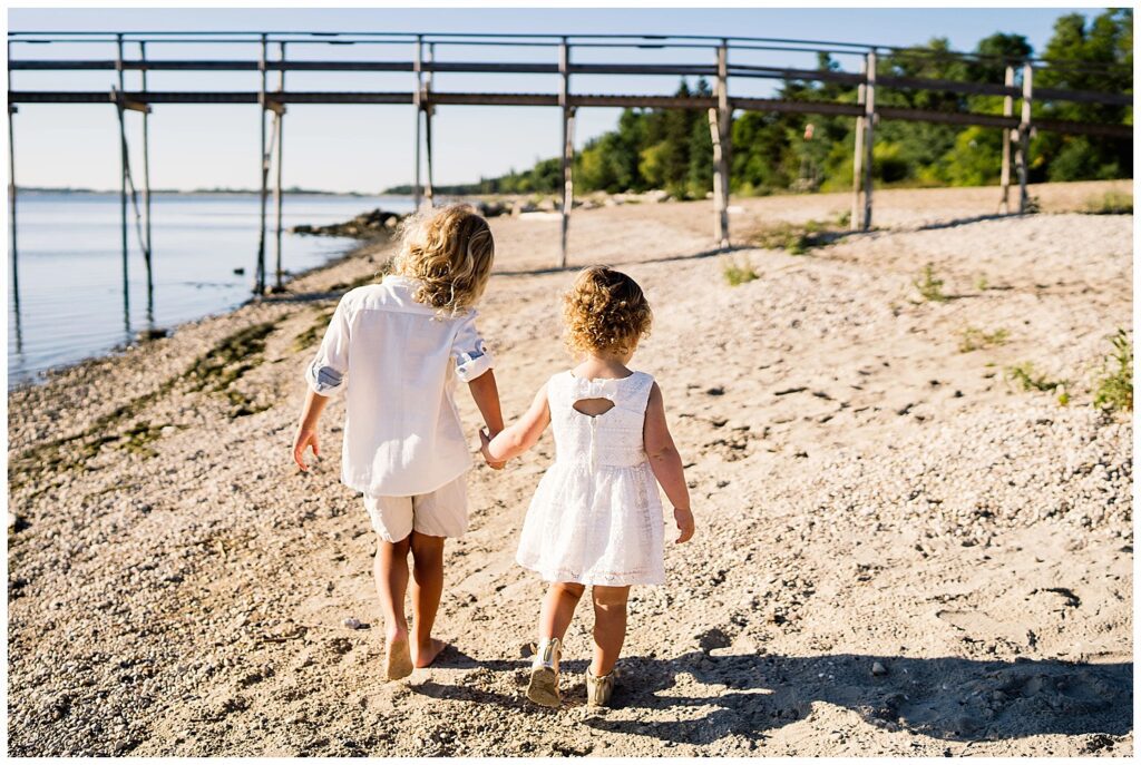 Winnipeg family photoshoot at Matlock Beach in the summer with beautiful morning light running around with their son and daughter.