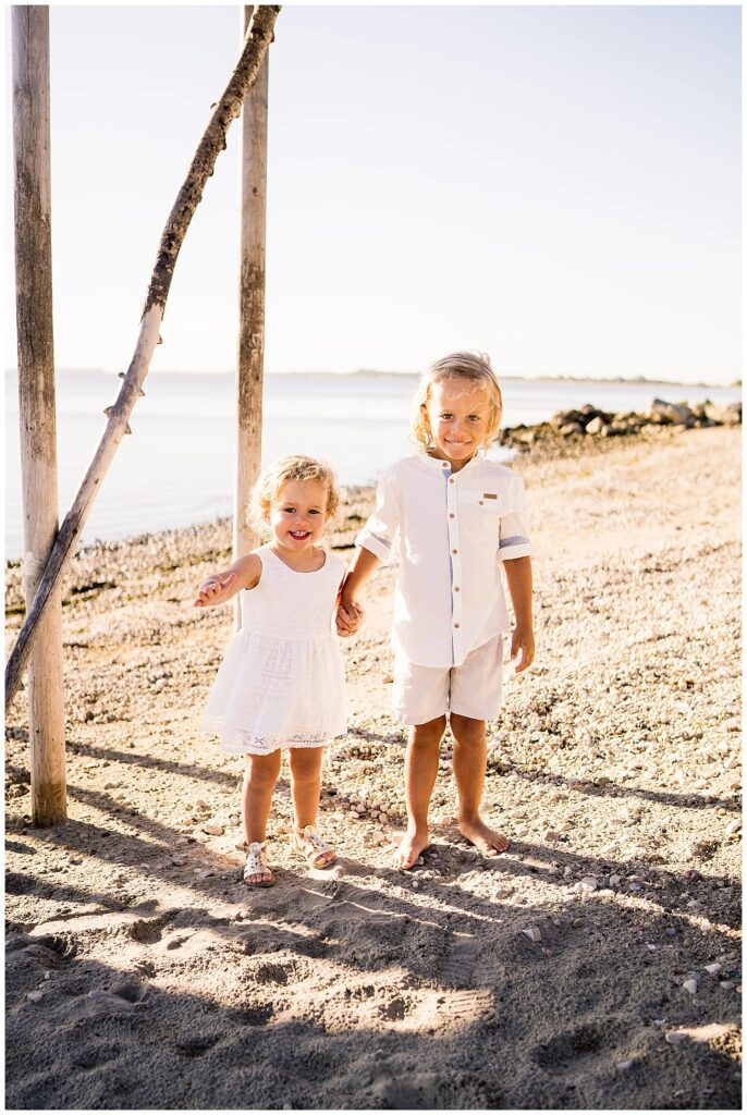 Winnipeg family photoshoot at Matlock Beach in the summer with beautiful morning light running around with their son and daughter.