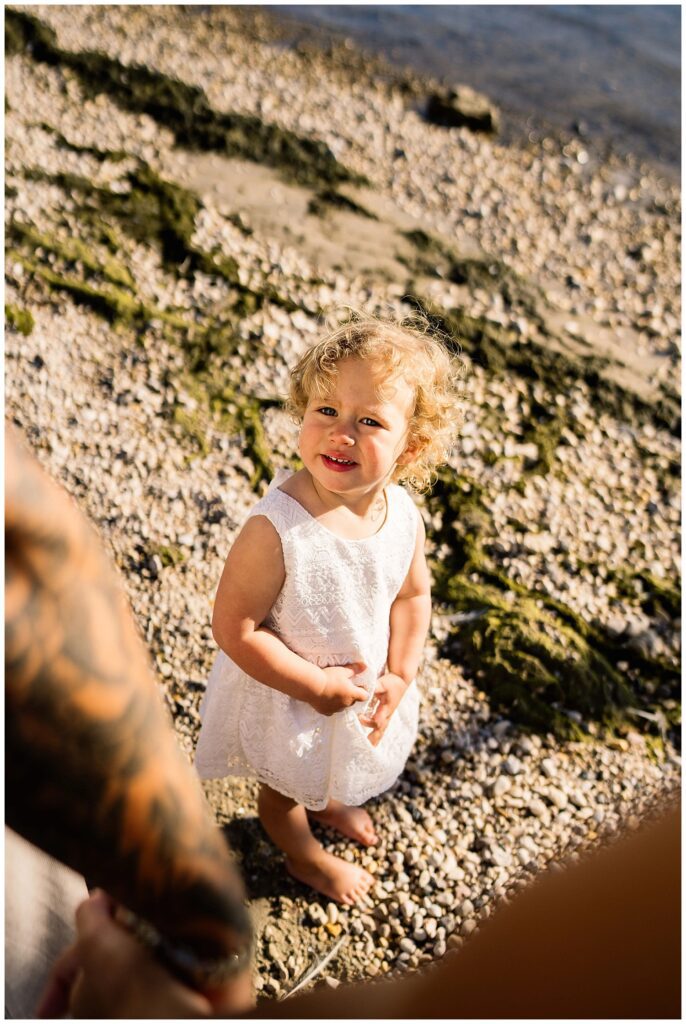 Winnipeg family photoshoot at Matlock Beach in the summer with beautiful morning light running around with their son and daughter.