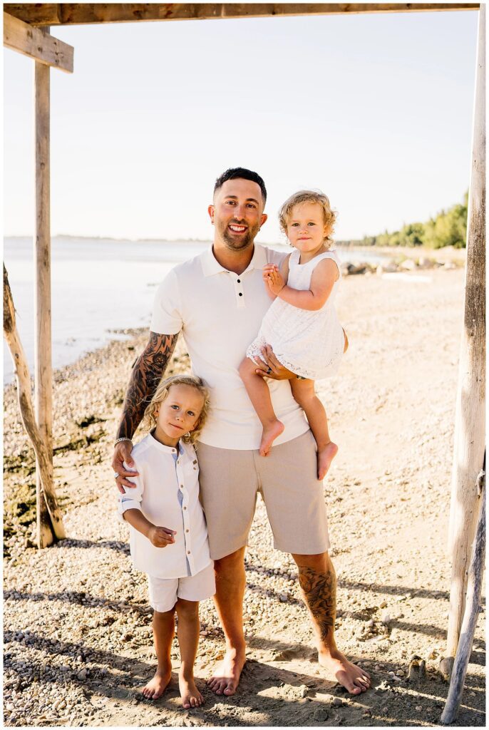 Winnipeg family photoshoot at Matlock Beach in the summer with beautiful morning light running around with their son and daughter.