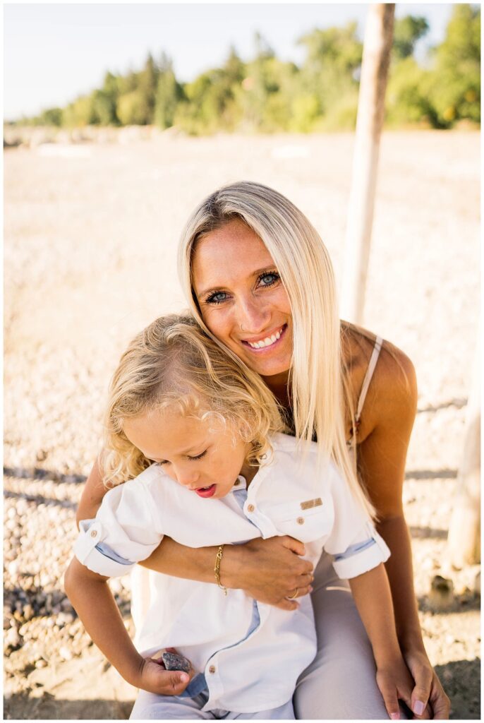 Winnipeg family photoshoot at Matlock Beach in the summer with beautiful morning light running around with their son and daughter.