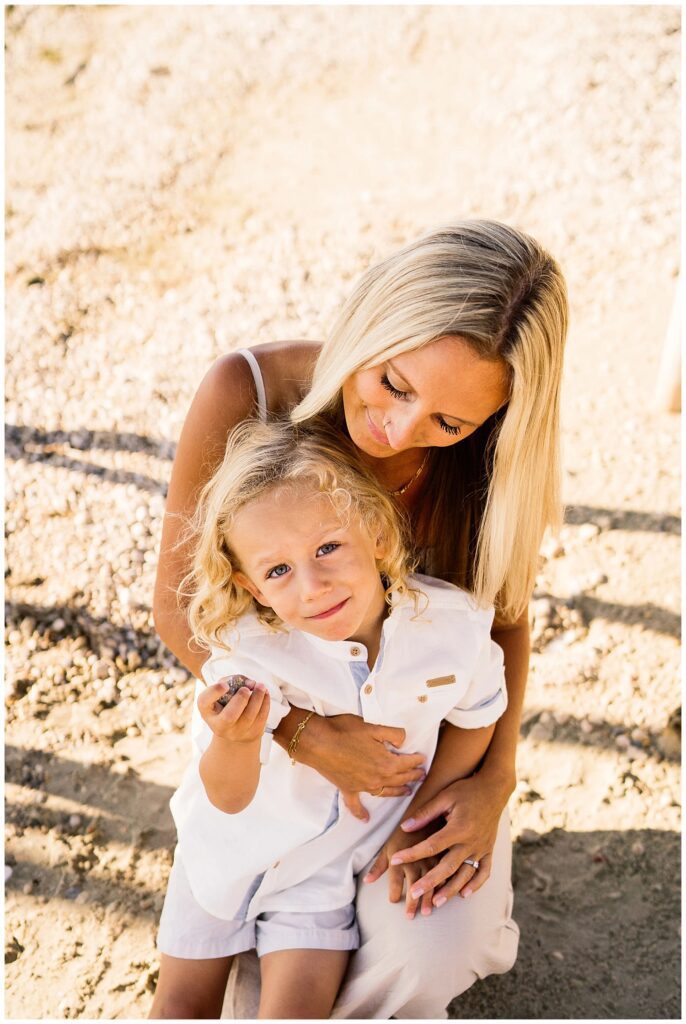 Winnipeg family photoshoot at Matlock Beach in the summer with beautiful morning light running around with their son and daughter.