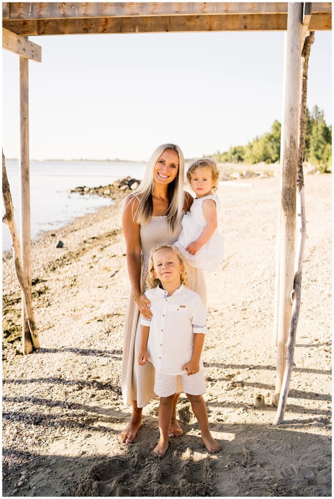 Winnipeg family photoshoot at Matlock Beach in the summer with beautiful morning light running around with their son and daughter.