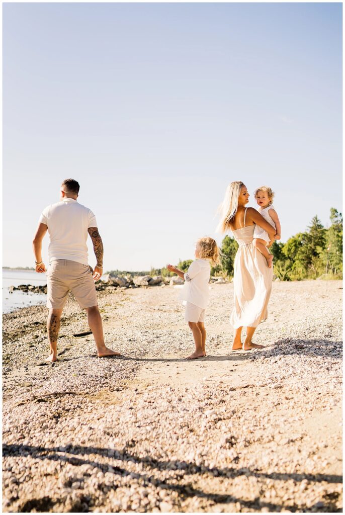 Winnipeg family photoshoot at Matlock Beach in the summer with beautiful morning light running around with their son and daughter.