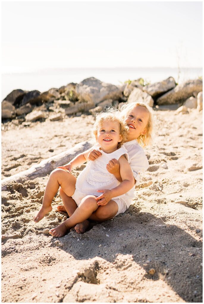 Winnipeg family photoshoot at Matlock Beach in the summer with beautiful morning light running around with their son and daughter.