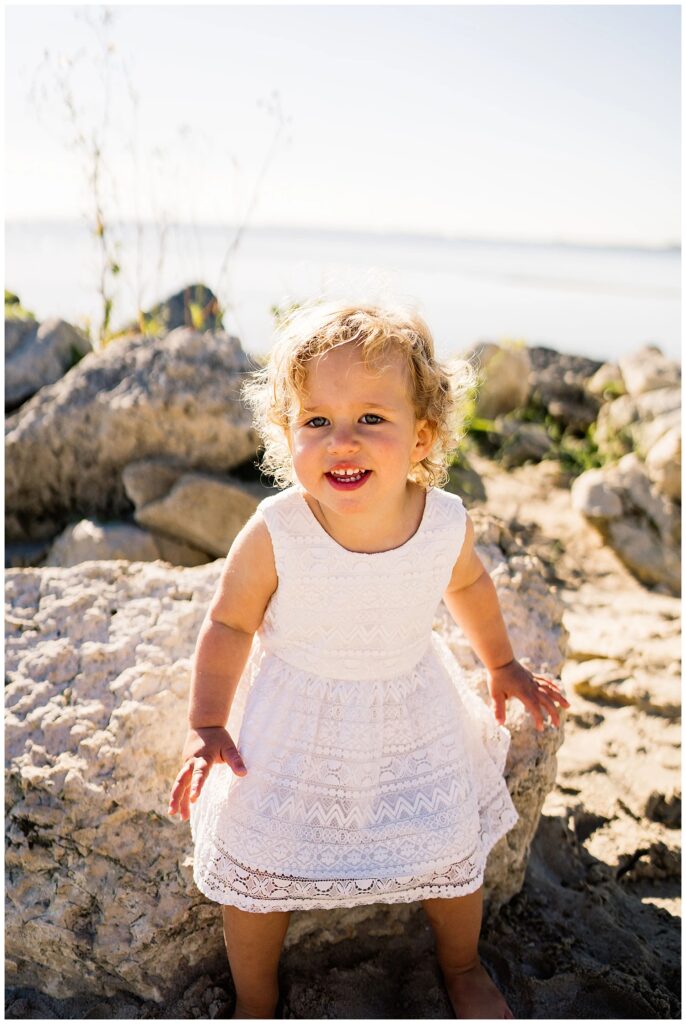Winnipeg family photoshoot at Matlock Beach in the summer with beautiful morning light running around with their son and daughter.