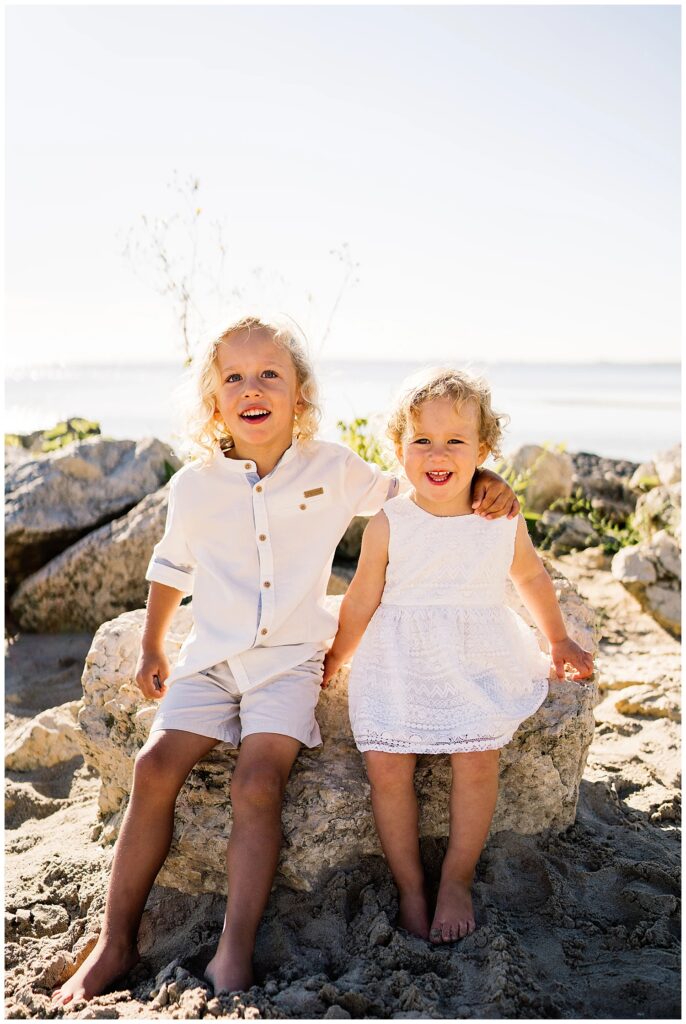 Winnipeg family photoshoot at Matlock Beach in the summer with beautiful morning light running around with their son and daughter.