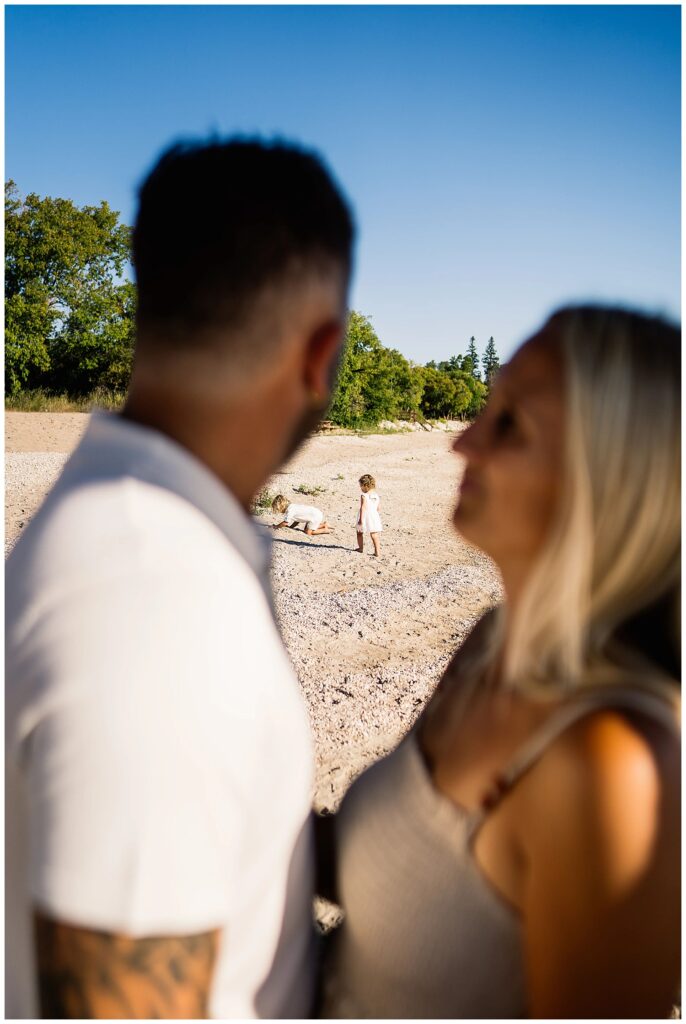 Winnipeg family photoshoot at Matlock Beach in the summer with beautiful morning light running around with their son and daughter.