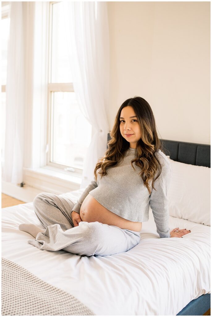 Winnipeg maternity photographer captures twin pregnancy in studio in downtown winnipeg photography studio.