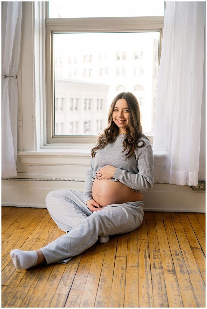 Winnipeg maternity photographer captures twin pregnancy in studio in downtown winnipeg photography studio.