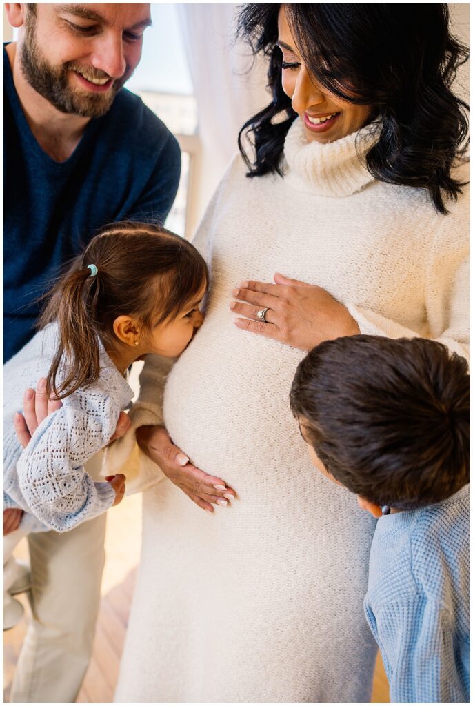Winnipeg maternity photographer captures lifestyle maternity session in studio with baby number 3 on the way in downtown winnipeg at my studio.
