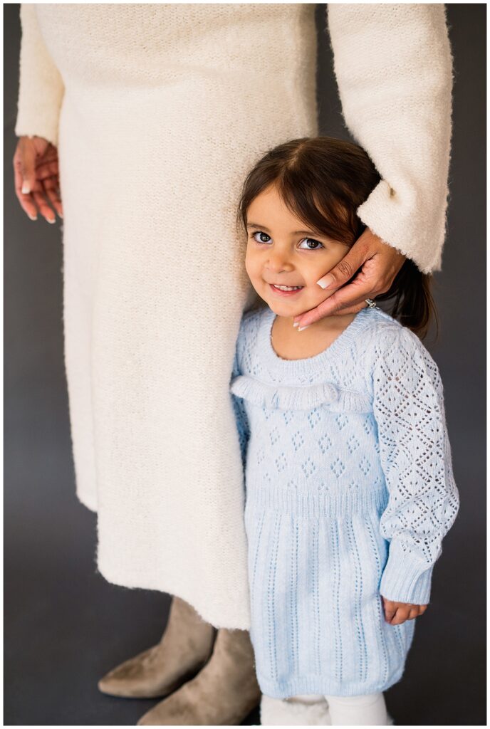 Winnipeg maternity photographer captures lifestyle maternity session in studio with baby number 3 on the way in downtown winnipeg at my studio.