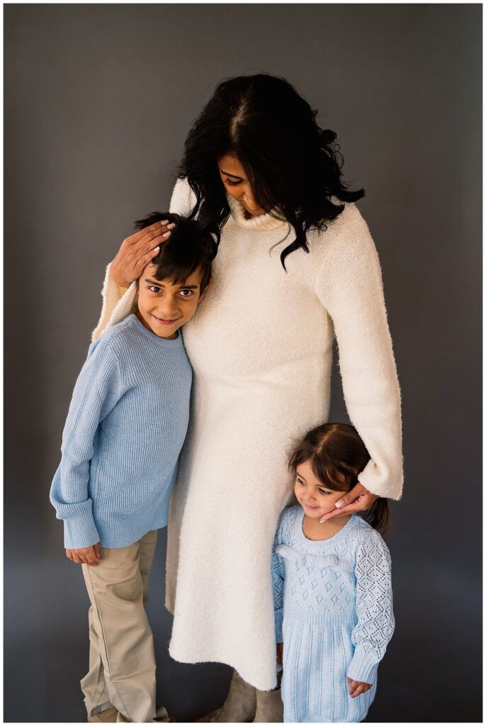 Winnipeg maternity photographer captures lifestyle maternity session in studio with baby number 3 on the way in downtown winnipeg at my studio.