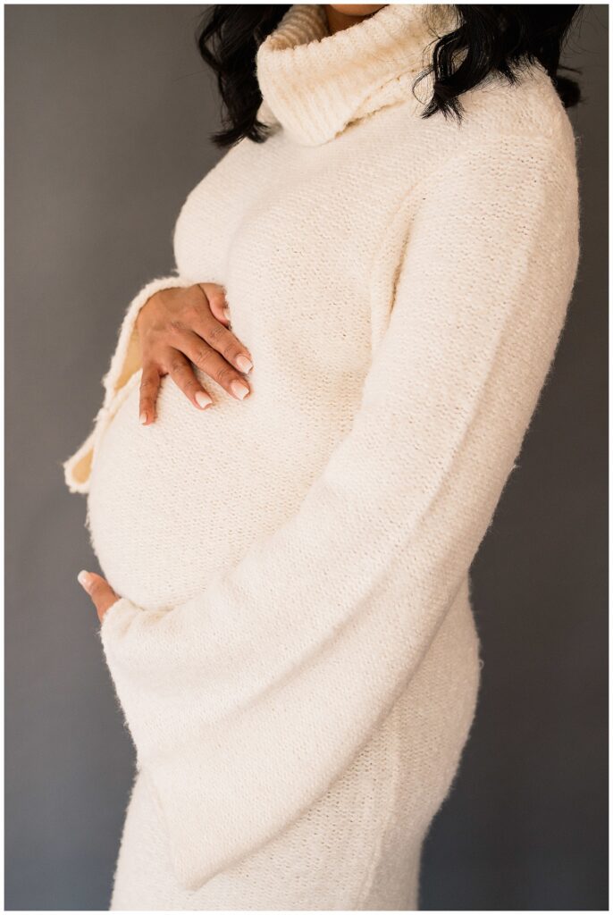 Winnipeg maternity photographer captures lifestyle maternity session in studio with baby number 3 on the way in downtown winnipeg at my studio.