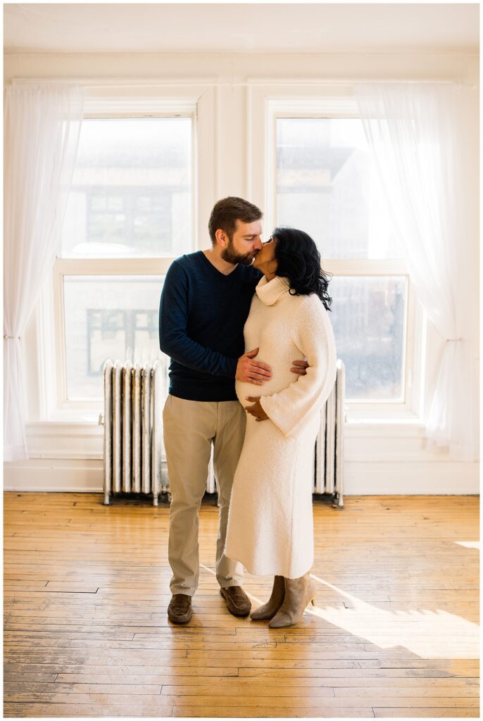 Winnipeg maternity photographer captures lifestyle maternity session in studio with baby number 3 on the way in downtown winnipeg at my studio.