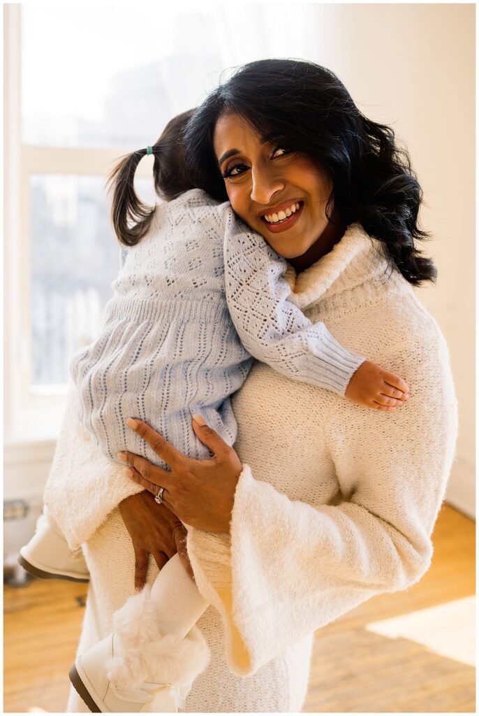 Winnipeg maternity photographer captures lifestyle maternity session in studio with baby number 3 on the way in downtown winnipeg at my studio.