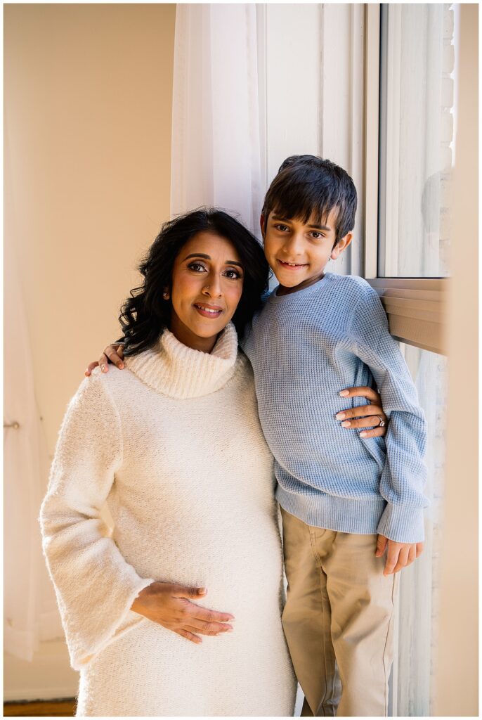 Winnipeg maternity photographer captures lifestyle maternity session in studio with baby number 3 on the way in downtown winnipeg at my studio.