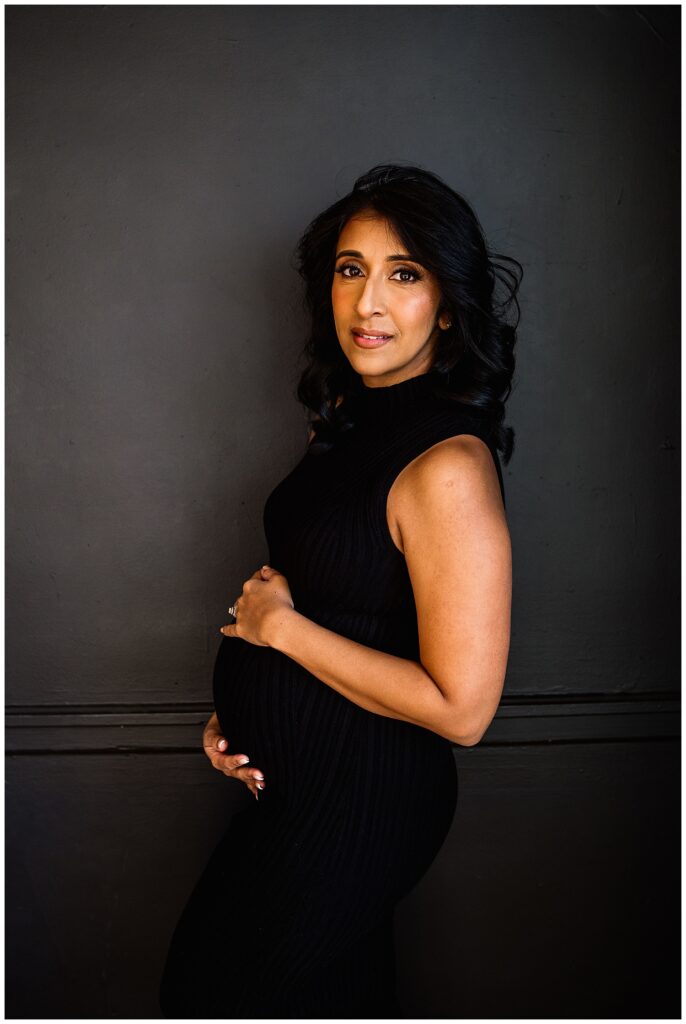 Winnipeg maternity photographer captures lifestyle maternity session in studio with baby number 3 on the way in downtown winnipeg at my studio.
