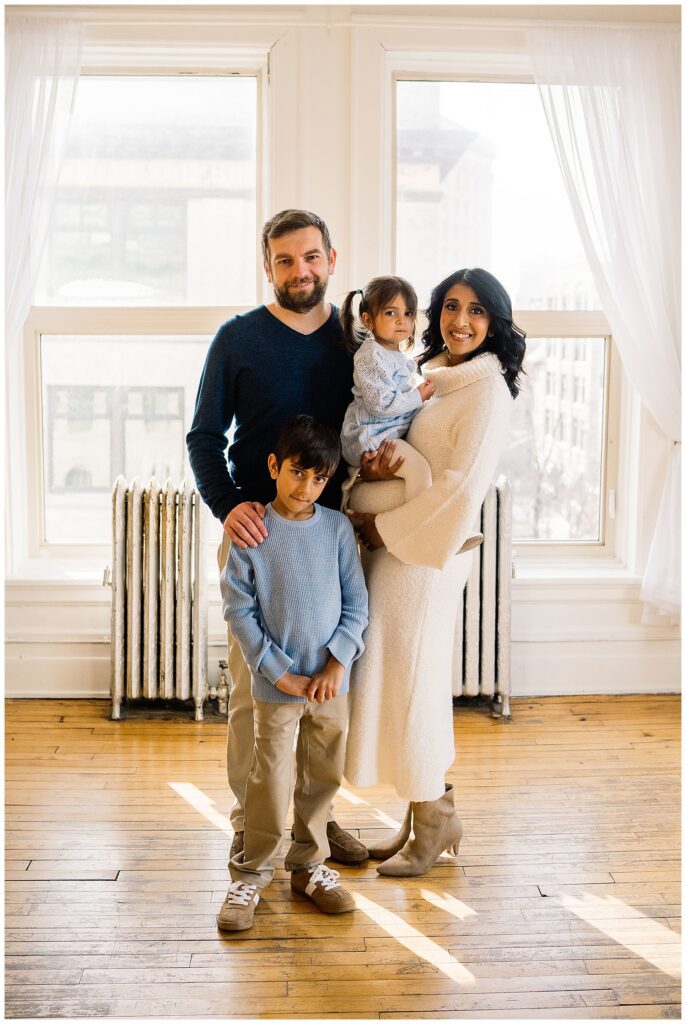 Winnipeg maternity photographer captures lifestyle maternity session in studio with baby number 3 on the way in downtown winnipeg at my studio.