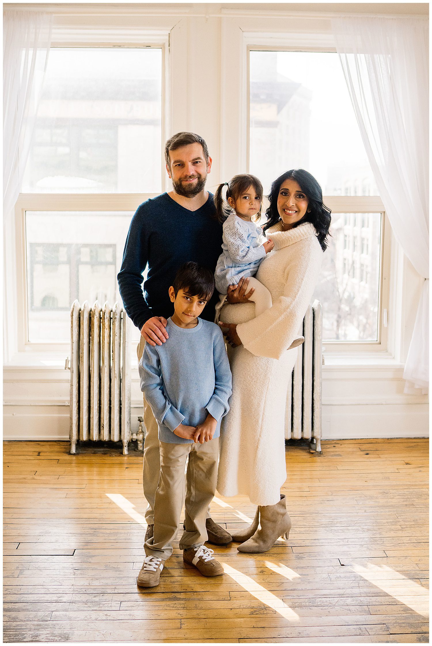 Winnipeg maternity photographer captures lifestyle maternity session in studio with baby number 3 on the way in downtown winnipeg at my studio.