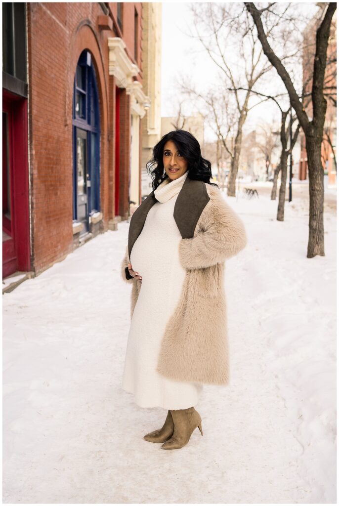 Winnipeg maternity photographer captures lifestyle maternity session in studio with baby number 3 on the way in downtown winnipeg at my studio.