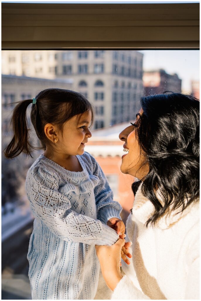 Winnipeg maternity photographer captures lifestyle maternity session in studio with baby number 3 on the way in downtown winnipeg at my studio.