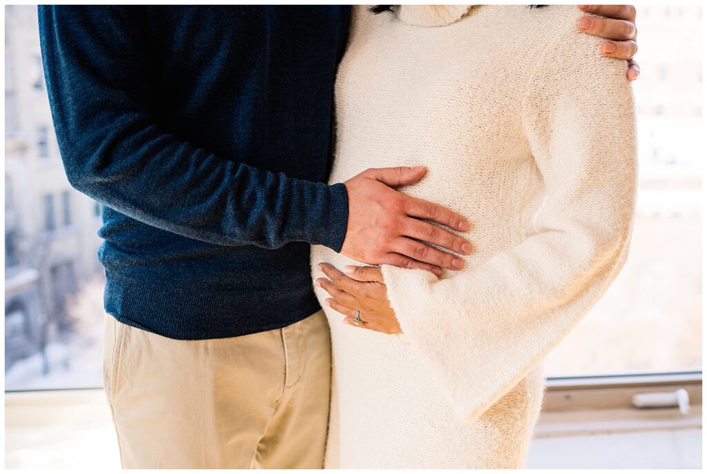 Winnipeg maternity photographer captures lifestyle maternity session in studio with baby number 3 on the way in downtown winnipeg at my studio.