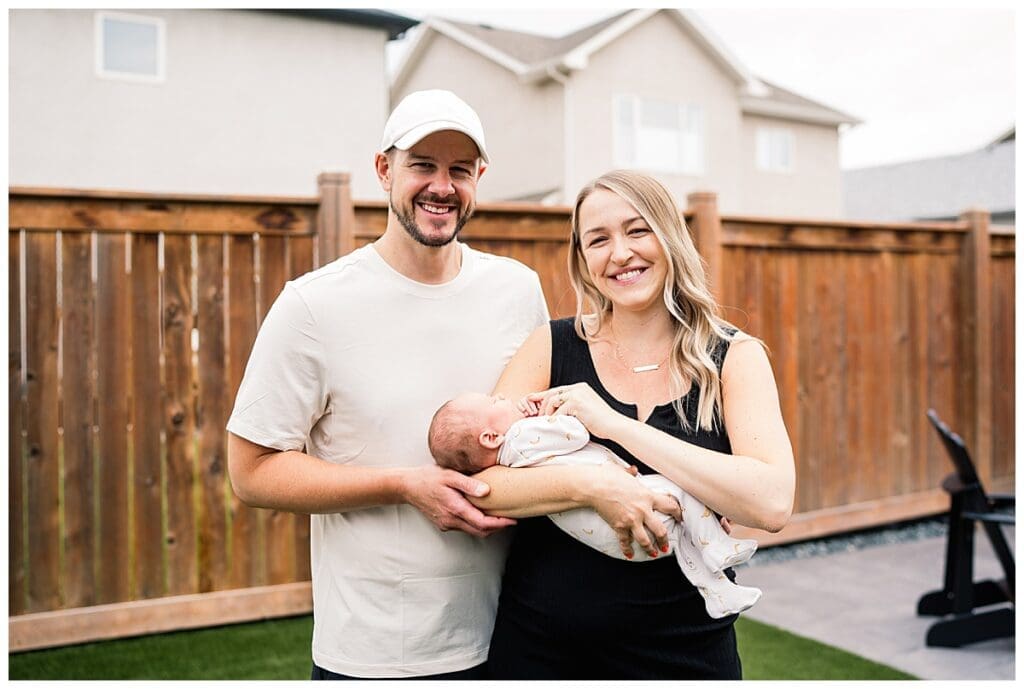 In home newborn session Winnipeg with baby Emma and parents