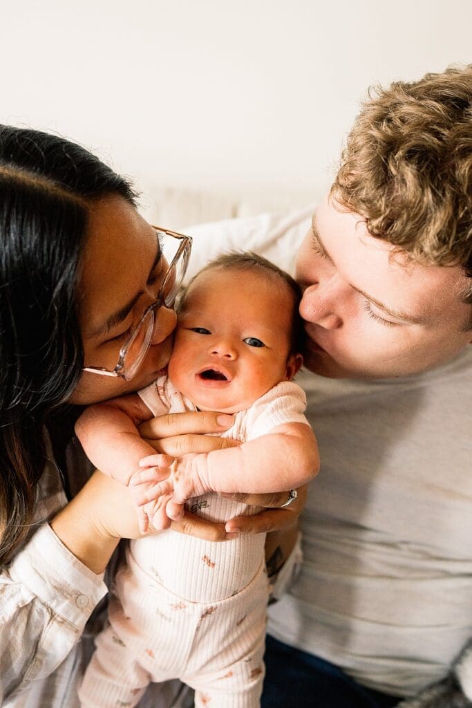 in home newborn session with a brand new baby with their cute dogs in their home