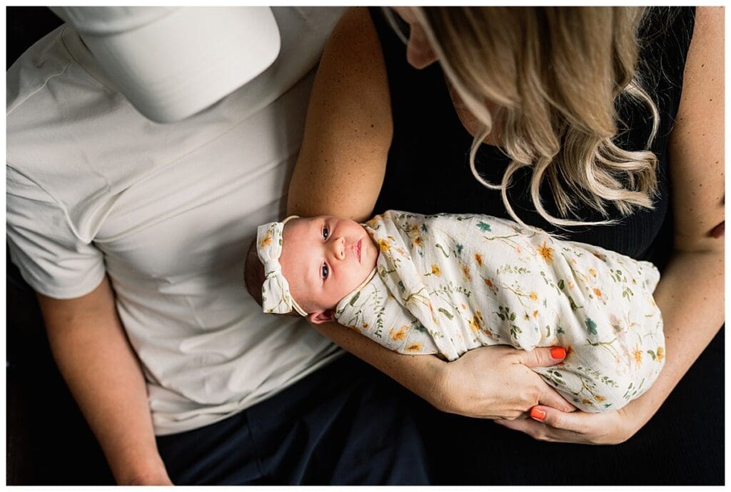 In home newborn session Winnipeg with baby Emma and parents