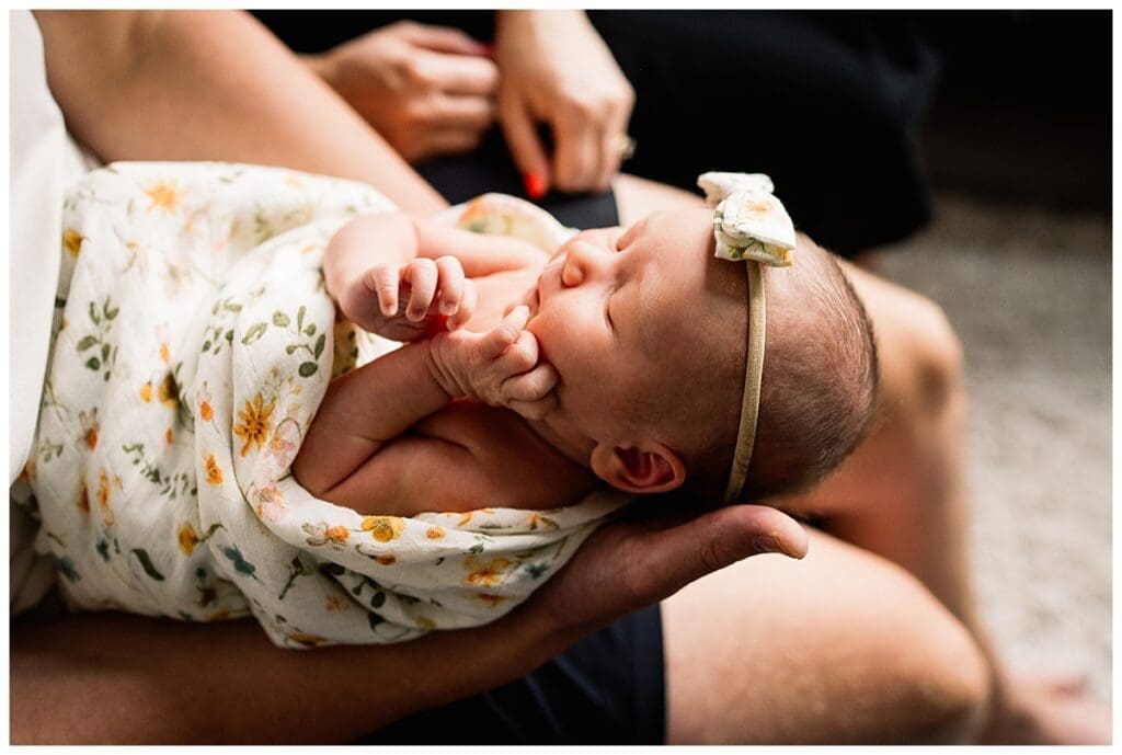 In home newborn session Winnipeg with baby Emma and parents