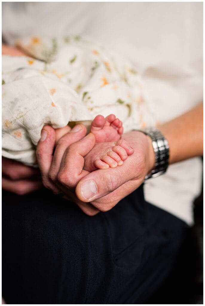 In home newborn session Winnipeg with baby Emma and parents