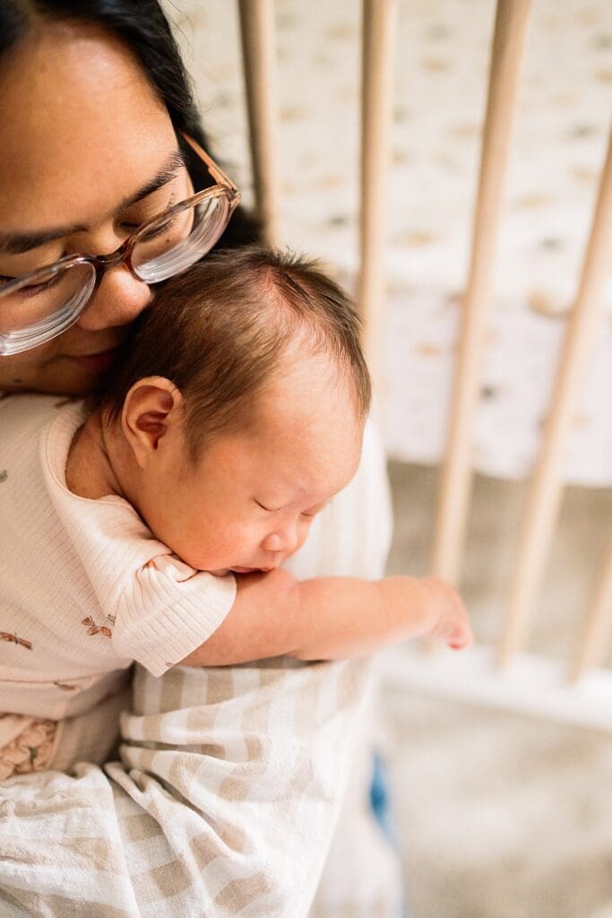 in home newborn photoshoot with a brand new baby with their cute dogs in their home