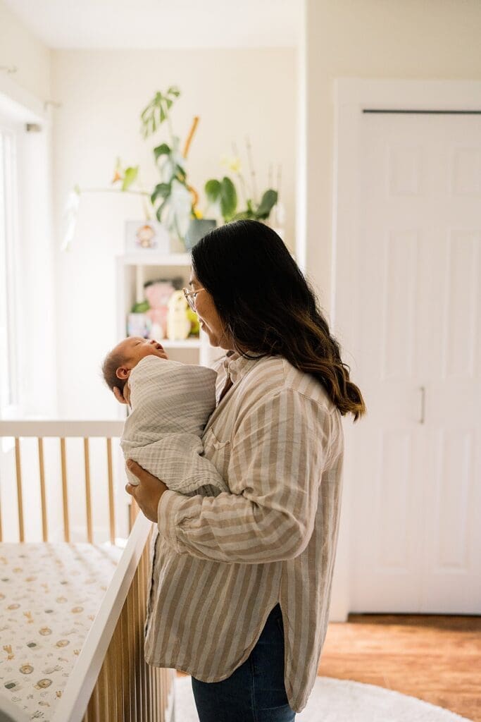 in home newborn photoshoot with a brand new baby with their cute dogs in their home
