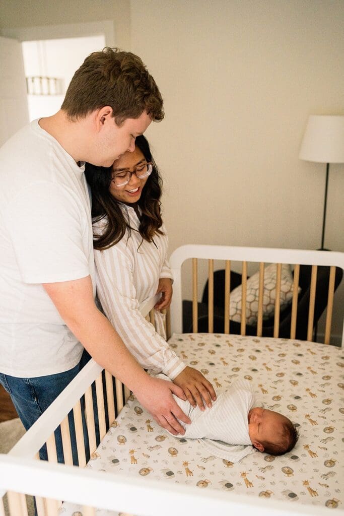 in home newborn photoshoot with a brand new baby with their cute dogs in their home