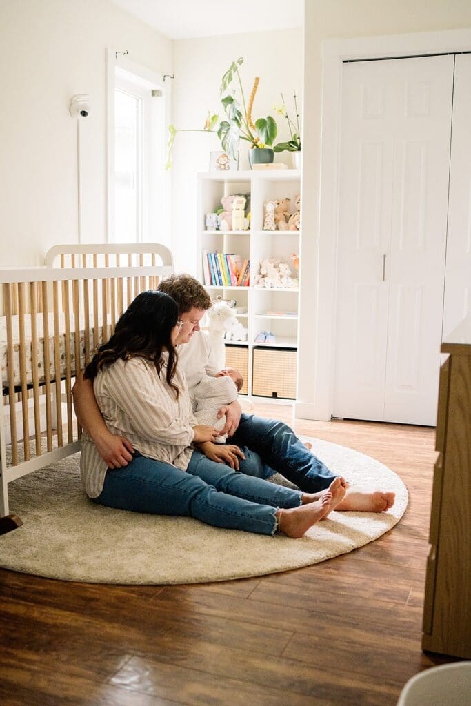 in home newborn photoshoot with a brand new baby with their cute dogs in their home