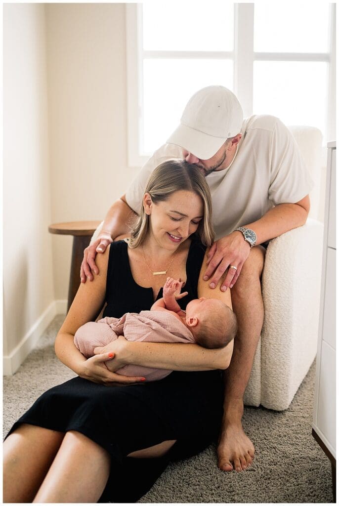 In home newborn session Winnipeg with baby Emma and parents