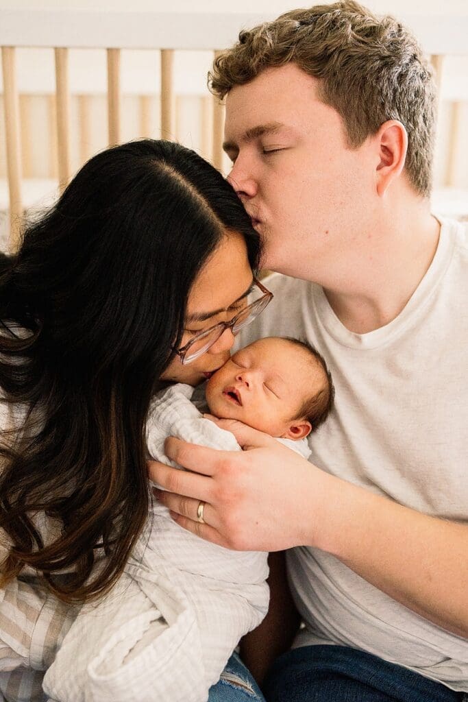 in home newborn photoshoot with a brand new baby with their cute dogs in their home